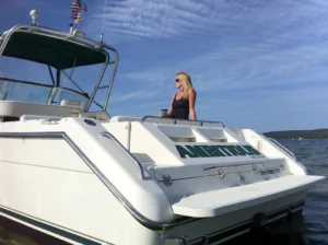 Instagrammable photo of blonde woman on the charter boat Ambitious.